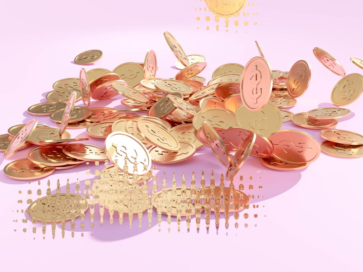 Falling bitcoin coins on a pink background