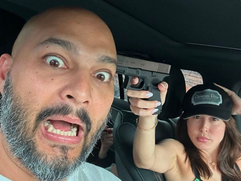 Crypto/NFT influencer King Kong posts a photo of his wife holding him at gunpoint to promote an NFT. Image source: Twitter