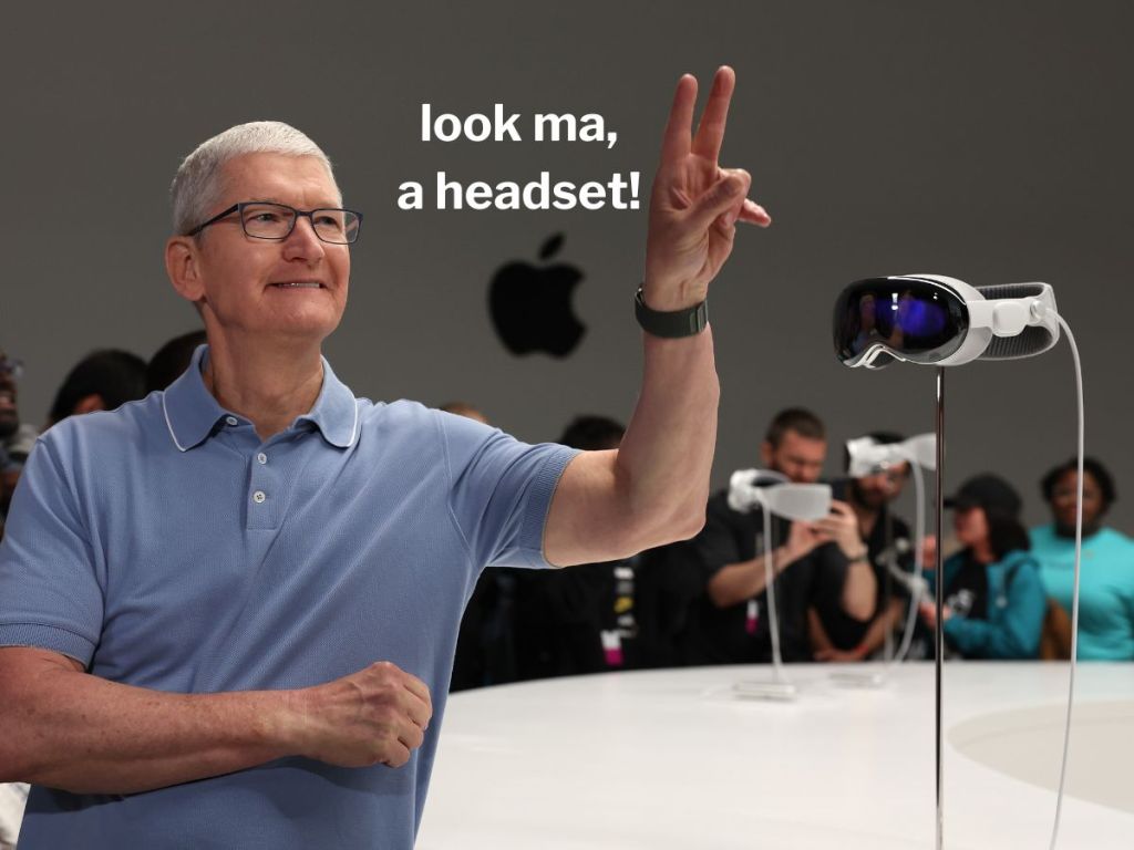CUPERTINO, CALIFORNIA - JUNE 05: Apple CEO Tim Cook stands next to the new Apple Vision Pro headset is displayed during the Apple Worldwide Developers Conference on June 05, 2023 in Cupertino, California. Apple CEO Tim Cook kicked off the annual WWDC23 developer conference with the announcement of the new Apple Vision Pro mixed reality headset. (Photo by Justin Sullivan/Getty Images)